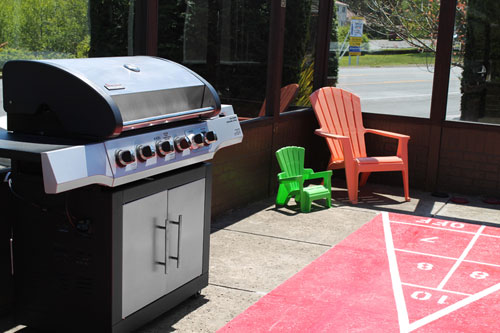 grill and shuffleboard outside